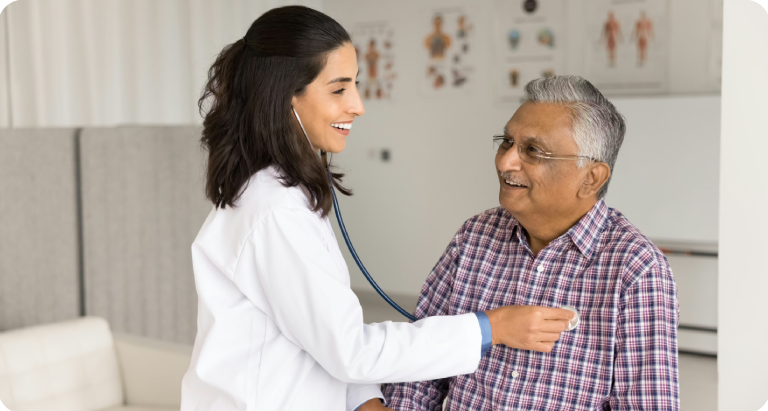 Elderly man gets his heartbeat checked from a provider